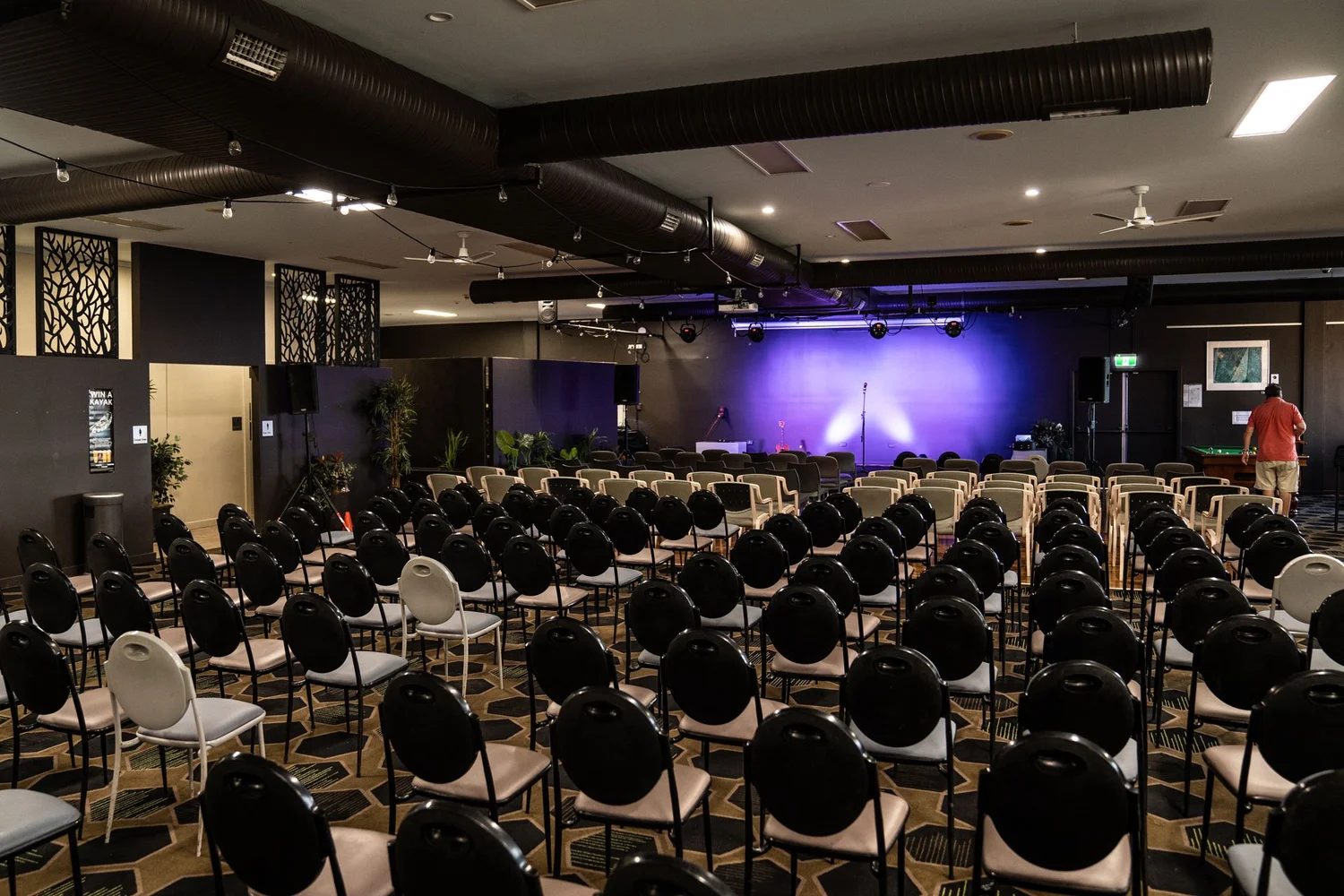 Auditorium at Pacific Palms Recreation Club set with seating over the custom axminster carpet